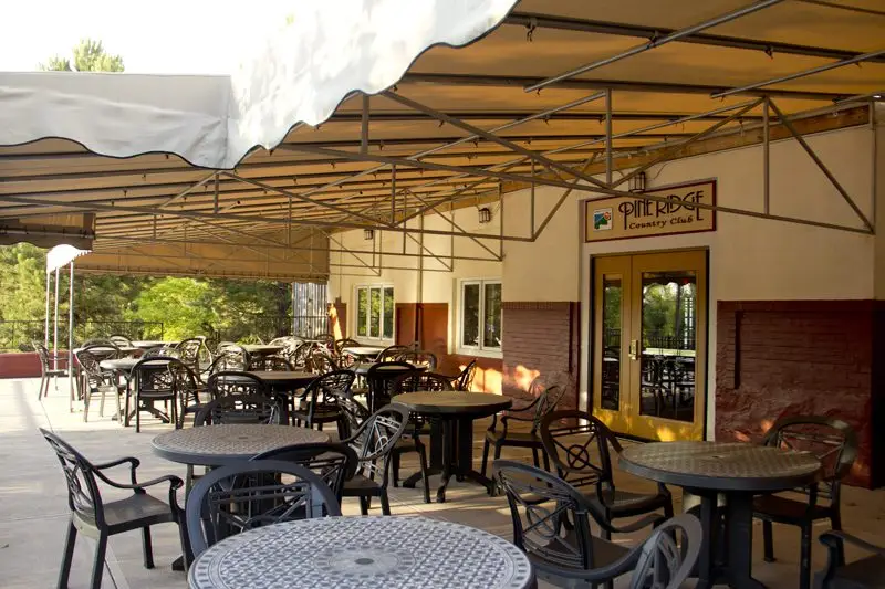 Outdoor patio seating at the Grille Room at Pine Ridge Country Club